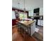 Kitchen features an island with seating, modern appliances, and ample cabinet space at 126 Brittany Dr, Canton, GA 30115