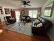 Cozy living room with hardwood floors, ceiling fan, and comfortable seating at 126 Brittany Dr, Canton, GA 30115