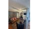 Cozy living room with a brown sofa and a ceiling fan at 126 Brittany Dr, Canton, GA 30115
