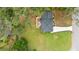 Aerial view of home showcasing new roof, patio, and expansive yard with driveway at 1934 Glen Echo Dr, Decatur, GA 30032