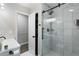 This bathroom has a glass shower with marble tile and black fixtures at 1934 Glen Echo Dr, Decatur, GA 30032