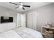 Bedroom features a ceiling fan, TV, and access to an adjoining room at 1934 Glen Echo Dr, Decatur, GA 30032