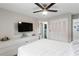 This bedroom has a ceiling fan, dresser, and a door leading to the bathroom at 1934 Glen Echo Dr, Decatur, GA 30032
