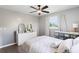 Bedroom featuring a ceiling fan, dresser, and a window with sheer curtains at 1934 Glen Echo Dr, Decatur, GA 30032