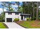 A charming house with a well manicured lawn and driveway offers great curb appeal at 1934 Glen Echo Dr, Decatur, GA 30032