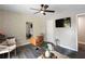 Bright living room features a decorative mirror, gray floors, and an entertainment space at 1934 Glen Echo Dr, Decatur, GA 30032