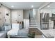 Open-concept layout showcases a living room connecting to a kitchen with stainless steel appliances and staircase at 1934 Glen Echo Dr, Decatur, GA 30032
