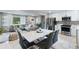 Open-concept living, dining, and kitchen area with stainless steel appliances at 1934 Glen Echo Dr, Decatur, GA 30032