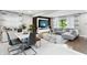 Open-concept living and dining area with modern furniture and stylish decor at 1934 Glen Echo Dr, Decatur, GA 30032