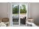 Inviting patio with comfortable seating, sliding door access, and serene outdoor view at 1934 Glen Echo Dr, Decatur, GA 30032