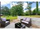 Relaxing patio with outdoor seating, well-maintained lawn, and beautiful landscaping at 1934 Glen Echo Dr, Decatur, GA 30032