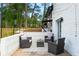 Outdoor patio area with comfortable seating, brick accents, and string lights at 1934 Glen Echo Dr, Decatur, GA 30032
