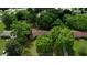 Aerial view of home with mature landscaping, surrounded by trees in a residential neighborhood at 2368 Ellis Court, Snellville, GA 30078