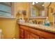 Bathroom features a vanity with granite countertop, mirror, and window with natural light at 2368 Ellis Court, Snellville, GA 30078
