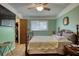 Calm and comfortable bedroom features a window, closet and TV at 2368 Ellis Court, Snellville, GA 30078