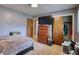 Bedroom features a neutral color scheme, natural light, closet, and hardwood-style flooring at 2368 Ellis Court, Snellville, GA 30078