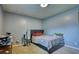 Bedroom features a neutral color scheme, natural light, minimalist decor, and hardwood-style flooring at 2368 Ellis Court, Snellville, GA 30078
