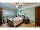 Comfortable bedroom features a window, closet and green walls at 2368 Ellis Court, Snellville, GA 30078