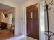 Inviting foyer with a beautiful front door, tile floor and coat rack adding to the home's charm at 2368 Ellis Court, Snellville, GA 30078