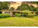 Charming ranch home with a spacious front yard and mature trees, creating a serene and inviting curb appeal at 2368 Ellis Court, Snellville, GA 30078