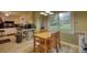 A kitchen area showcases a dining table, window, backyard view, and is adjoined to the main kitchen space at 2368 Ellis Court, Snellville, GA 30078