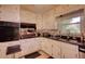 Classic kitchen with white cabinets, granite countertops, and modern appliances at 2368 Ellis Court, Snellville, GA 30078