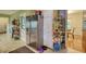 Spacious kitchen featuring stainless steel refrigerator, white cabinets, and tile flooring at 2368 Ellis Court, Snellville, GA 30078