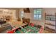 Spacious living area with entertainment options including a foosball table, TV and open access to the dining room at 2368 Ellis Court, Snellville, GA 30078