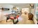 Spacious living room featuring a foosball table, couch, and natural light perfect for recreation and relaxation at 2368 Ellis Court, Snellville, GA 30078