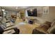 Spacious living room with neutral carpet, large television, brick fireplace and comfortable seating at 2368 Ellis Court, Snellville, GA 30078