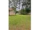 The backyard is large and features mature shade trees at 432 Manor Estates Dr, Stockbridge, GA 30281