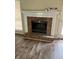 Close up of the living room brick fireplace, with a white mantle and hearth at 432 Manor Estates Dr, Stockbridge, GA 30281
