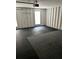 Spacious unfinished garage with exposed studs and a dark rubber tile floor at 432 Manor Estates Dr, Stockbridge, GA 30281