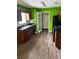The kitchen features dark cabinets, stone backsplash, and modern flooring at 432 Manor Estates Dr, Stockbridge, GA 30281