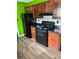 The kitchen features dark appliances, stylish backsplash, and modern flooring at 432 Manor Estates Dr, Stockbridge, GA 30281