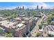 Urban aerial view highlighting the historic building with the city skyline at 542 Ralph Mcgill Ne Blvd # 7, Atlanta, GA 30312