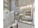 Modern bathroom featuring shower, granite vanity, and unique concrete block accent wall at 542 Ralph Mcgill Ne Blvd # 7, Atlanta, GA 30312
