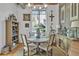Bright dining area with modern lighting, elegant decor, exposed concrete block, and large window at 542 Ralph Mcgill Ne Blvd # 7, Atlanta, GA 30312