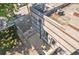 Rooftop exterior featuring a private patio with concrete block walls, a rooftop AC unit, and a view of mature trees at 542 Ralph Mcgill Ne Blvd # 7, Atlanta, GA 30312
