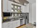 Modern kitchen with stainless steel appliances, granite counters, and concrete block architectural elements at 542 Ralph Mcgill Ne Blvd # 7, Atlanta, GA 30312