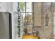 This kitchenette features stainless steel appliances and brick accent walls at 542 Ralph Mcgill Ne Blvd # 7, Atlanta, GA 30312