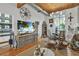 Bright open living space features a kitchen, dining area, and comfortable living area with a large screen tv at 542 Ralph Mcgill Ne Blvd # 7, Atlanta, GA 30312