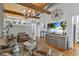 Airy living room with beamed ceiling, modern decor, beach scene TV display, and ample seating at 542 Ralph Mcgill Ne Blvd # 7, Atlanta, GA 30312