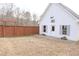 Spacious backyard featuring a well-maintained lawn and detached garage at 762 Thompson Ln, Loganville, GA 30052