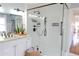 Bathroom with a double vanity, and glass-enclosed shower at 762 Thompson Ln, Loganville, GA 30052