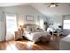Bedroom with vaulted ceiling, wainscoting, wood floors, and lots of natural light at 762 Thompson Ln, Loganville, GA 30052