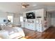 Bright bedroom with built-in shelving and cabinets, and a workspace with desk by the window at 762 Thompson Ln, Loganville, GA 30052