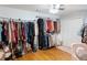 Spacious closet with hanging clothes and storage shelves at 762 Thompson Ln, Loganville, GA 30052