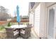 Cozy outdoor deck featuring comfortable seating, a table, and an umbrella at 762 Thompson Ln, Loganville, GA 30052