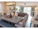 Dining room with a modern table and chairs, fireplace, and sliding barn doors that lead to the backyard at 762 Thompson Ln, Loganville, GA 30052